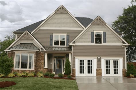 taupe siding house with metal roofs|best taupe exterior paint color.